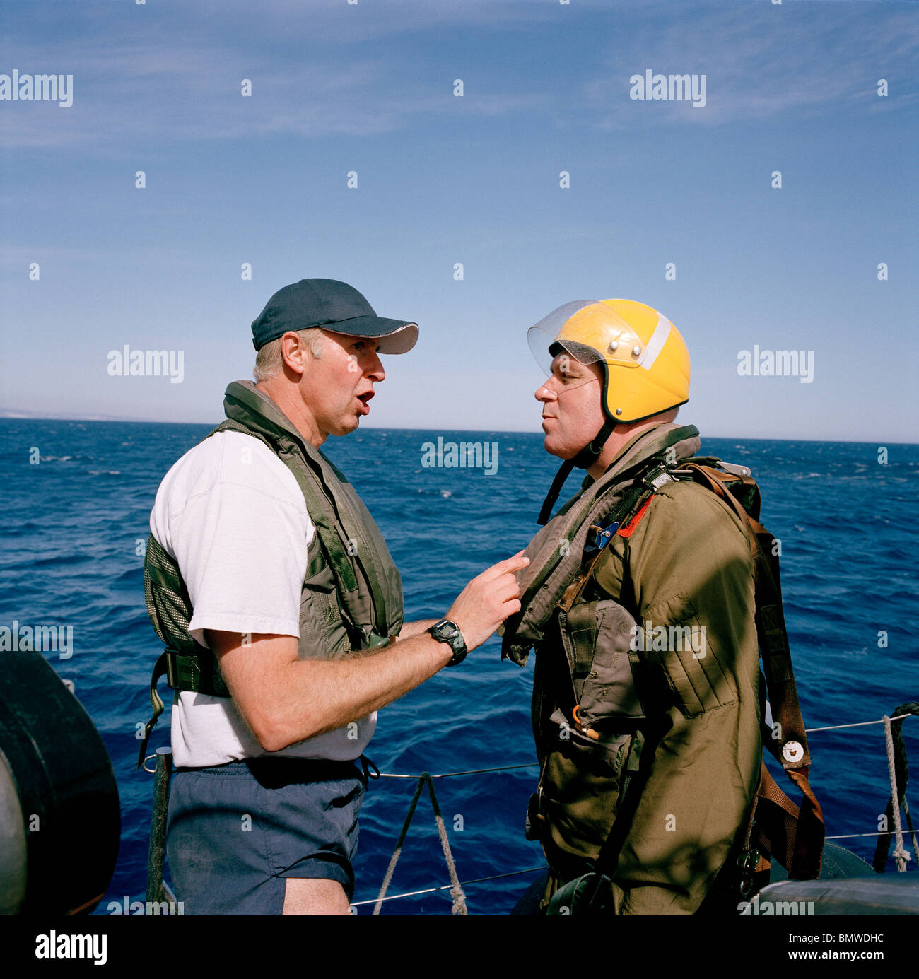 Red Arrows pilot prepares to jump into chilly Mediterranean to practice annual ditching at sea drill. Stock Photo