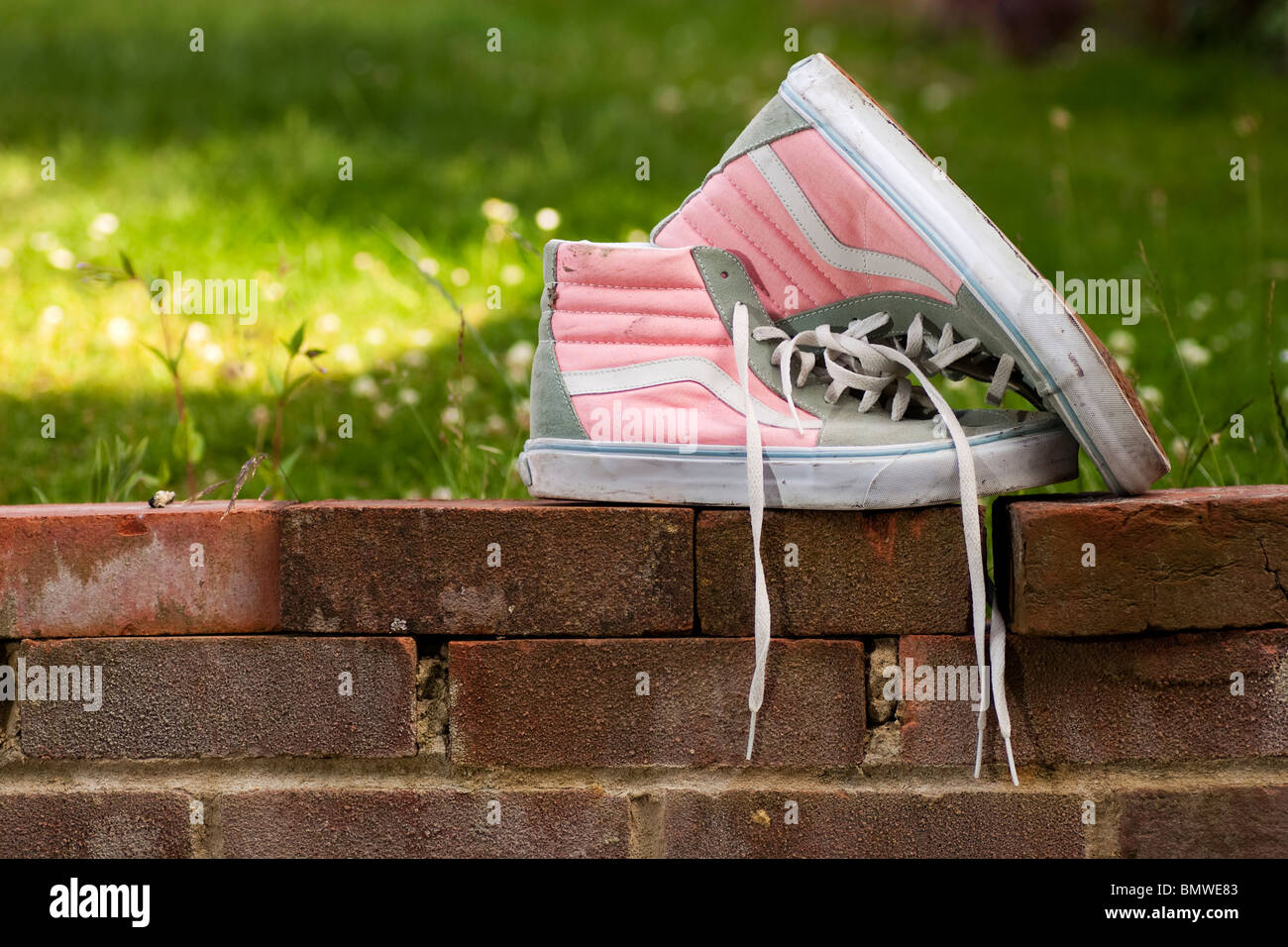 A pair of pink and grey retro trainers Stock Photo - Alamy