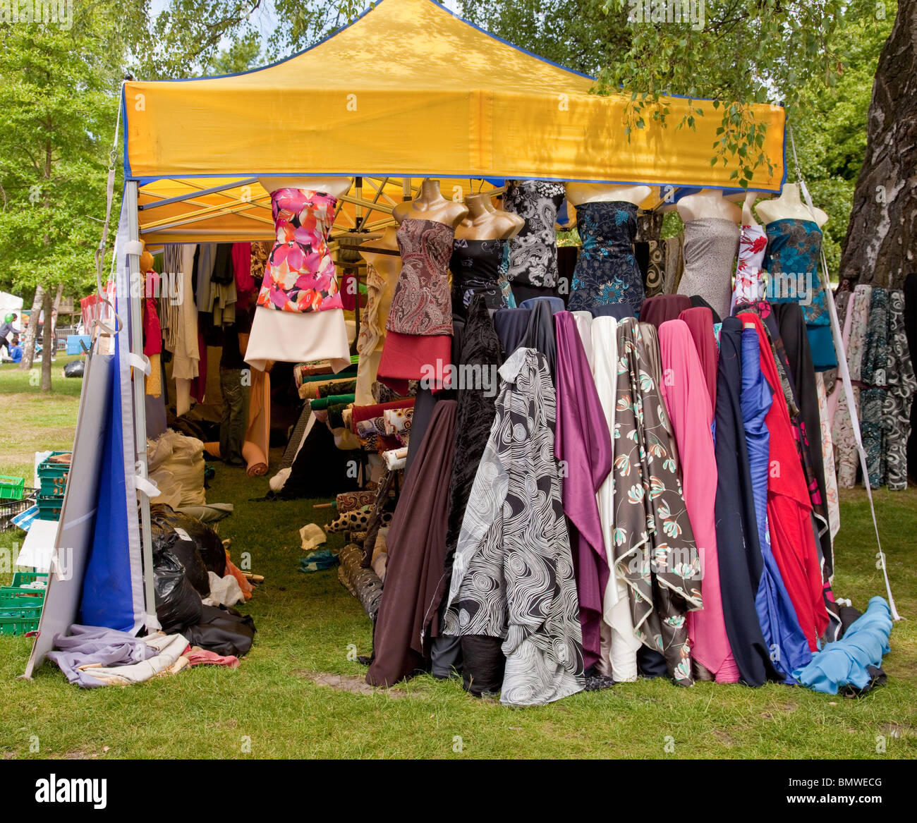 Stall with bales of Asian fabric for sale at Glasgow Mela 2010 in