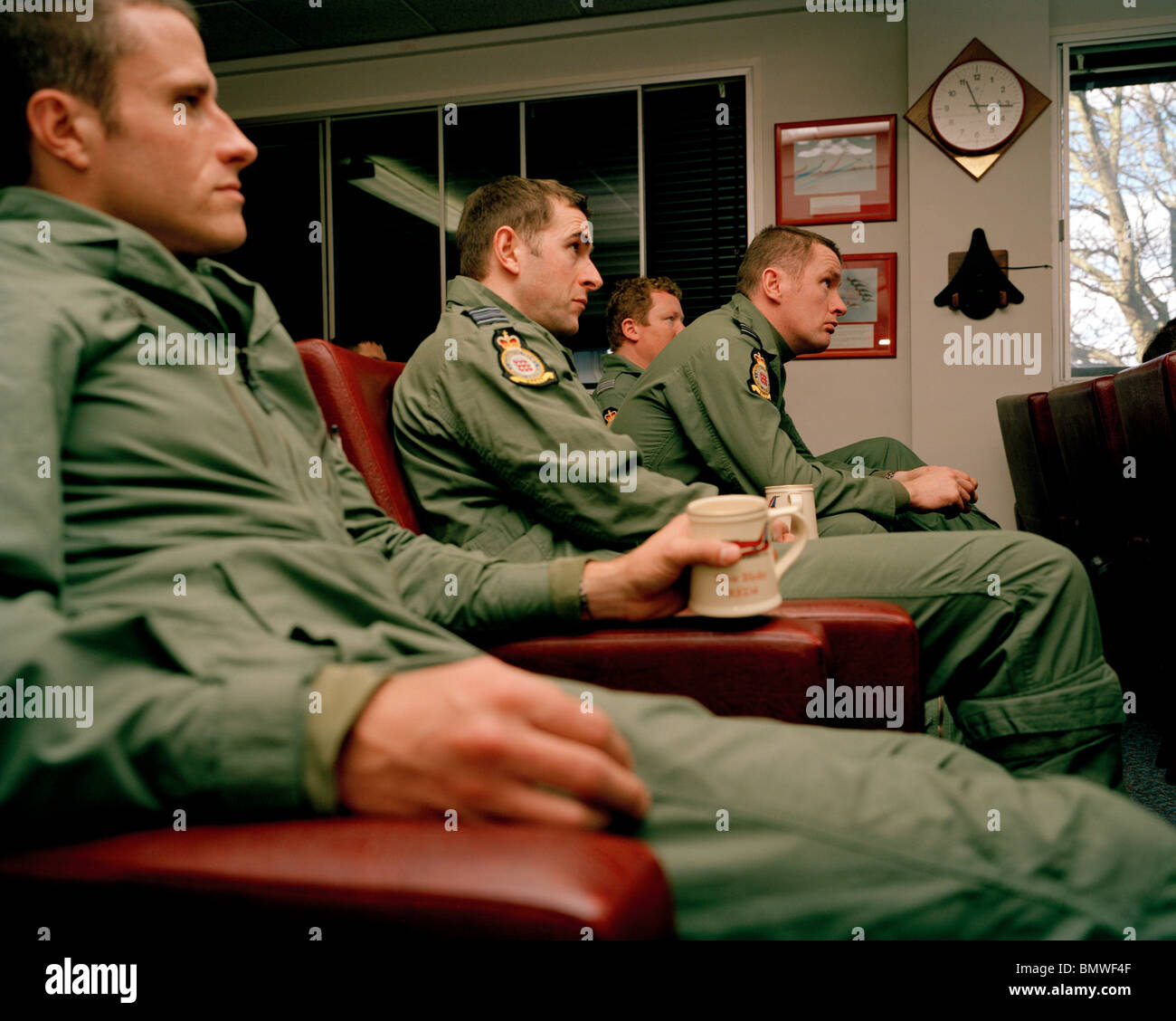 Pilot members of the 'Red Arrows', Britain's Royal Air Force aerobatic team in post-flight training debriefing. Stock Photo