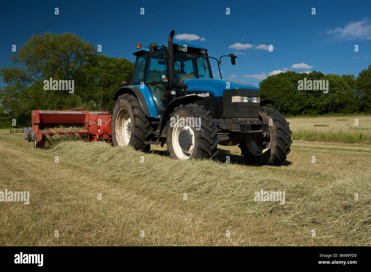 Tractor baling hay hires stock photography and images Alamy