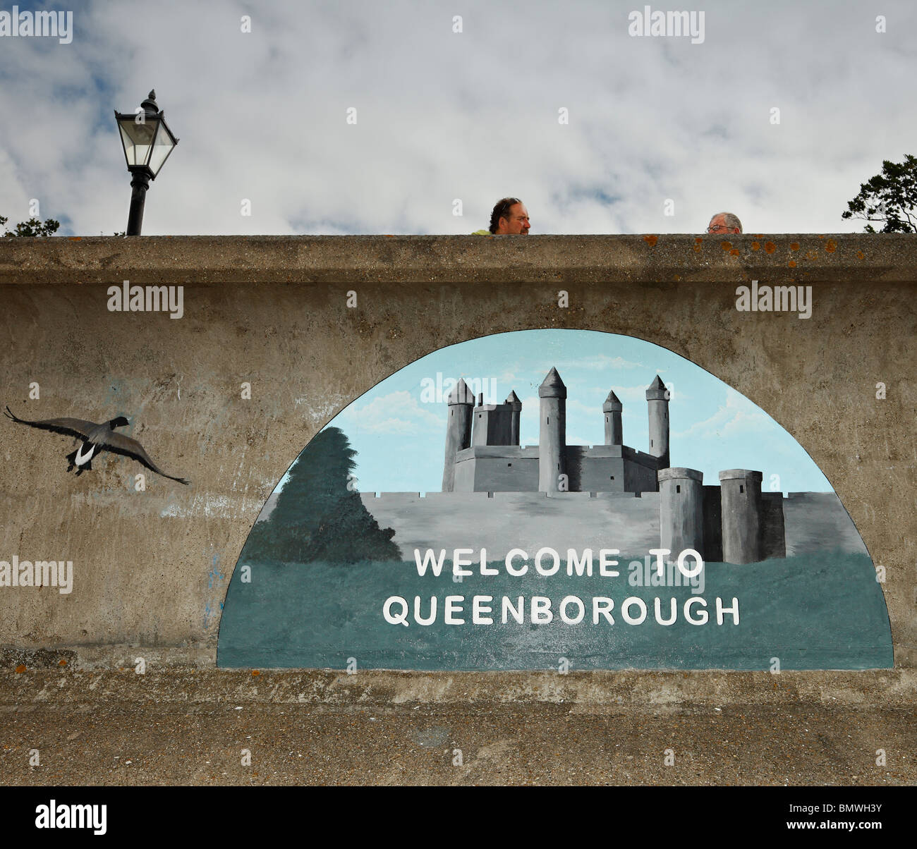 Welcome to Queenborough mural, painted on sea defences. Stock Photo