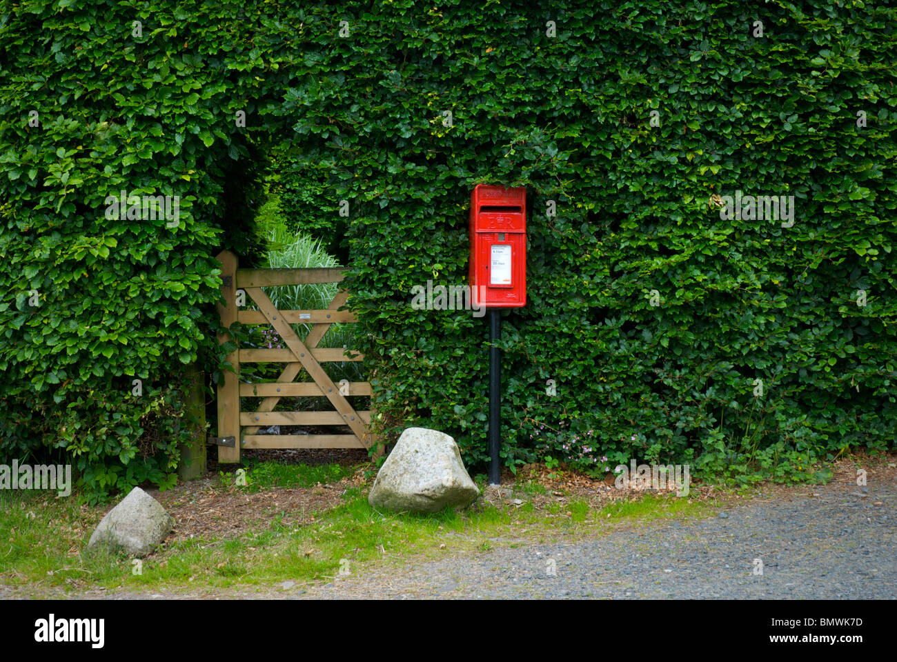 Postbox and gate, Cumbria, England UK Stock Photo