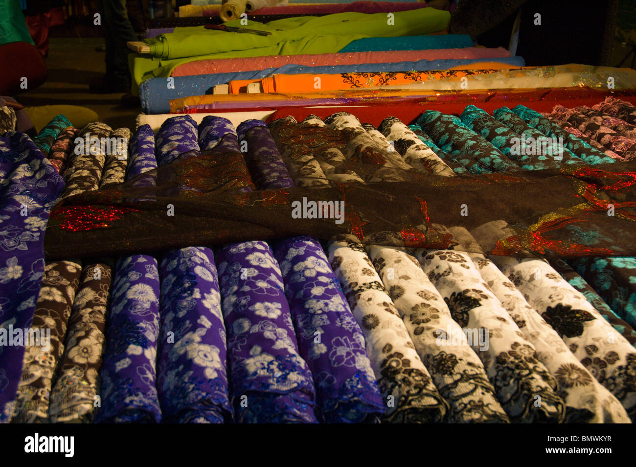 Textile fabrics for sale at a market in Upton Park east London England