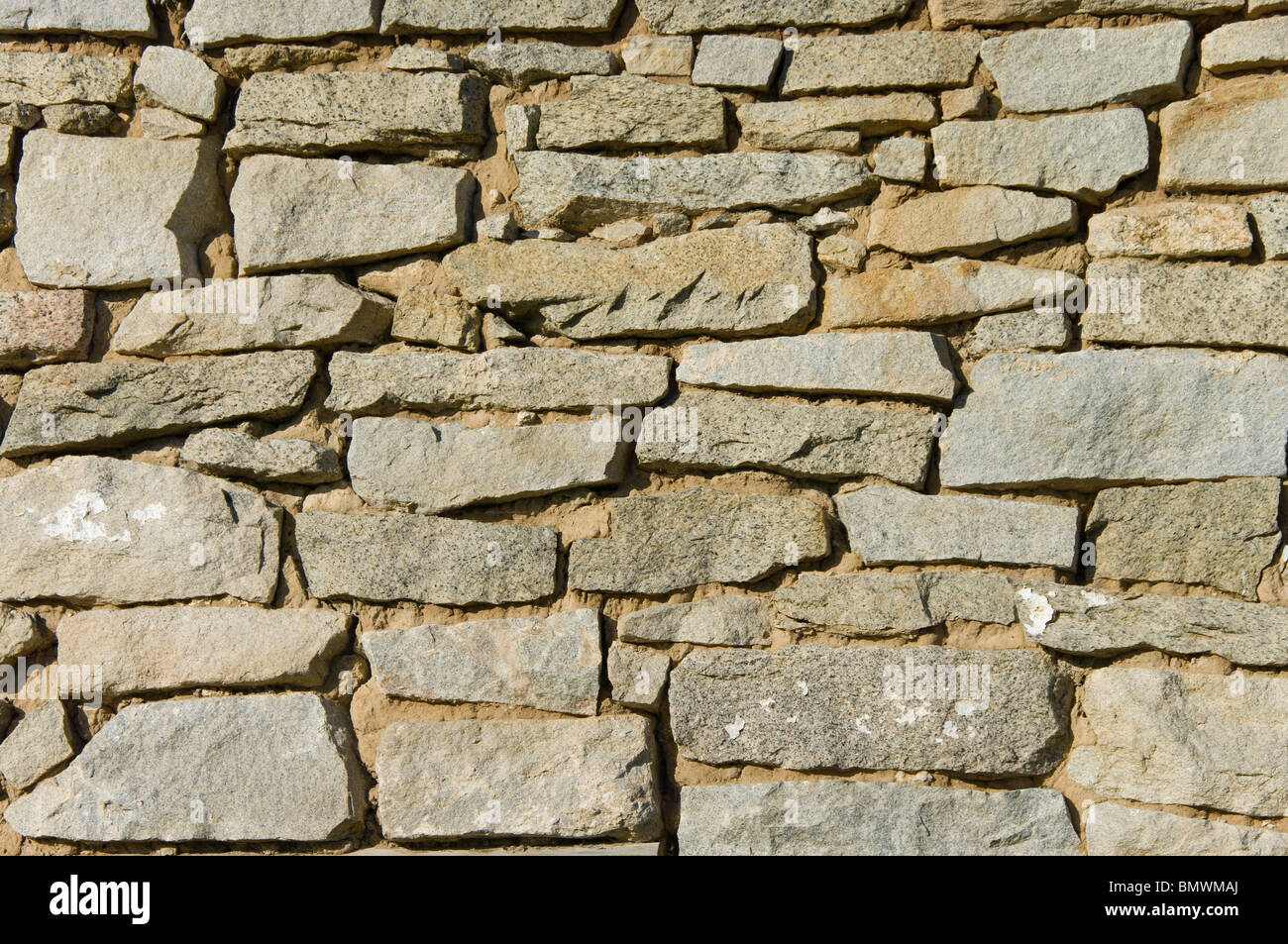 Old stone wall background shot in direct sunlight Stock Photo - Alamy