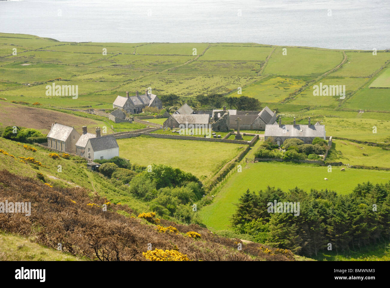 Houses, chapel and remains of ancient monastery on Bardsey Island, North Wales Stock Photo