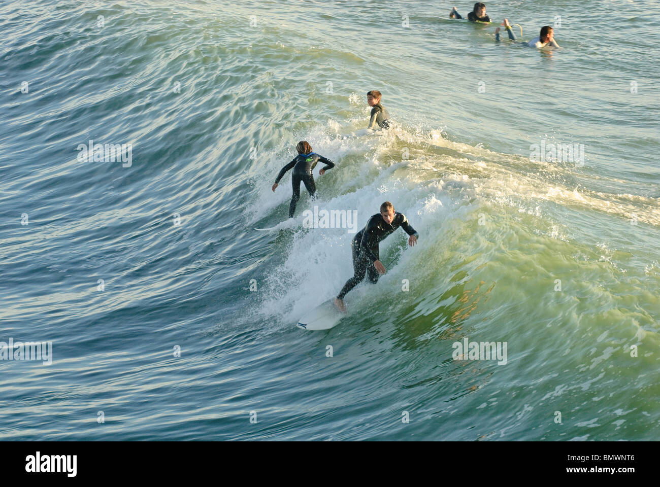 Large group of surfers gathered in Surf City, USA at Huntington Beach, California. Stock Photo