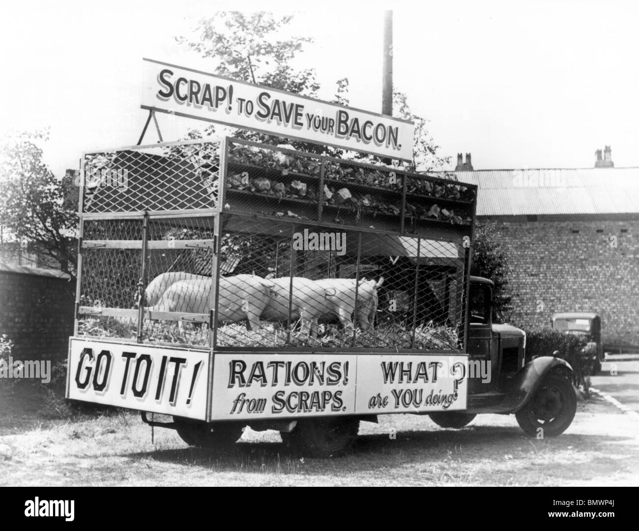 Morris salvage lorry in Liverpool 1941promoting recycling of scraps during World war 2 rationing. Stock Photo