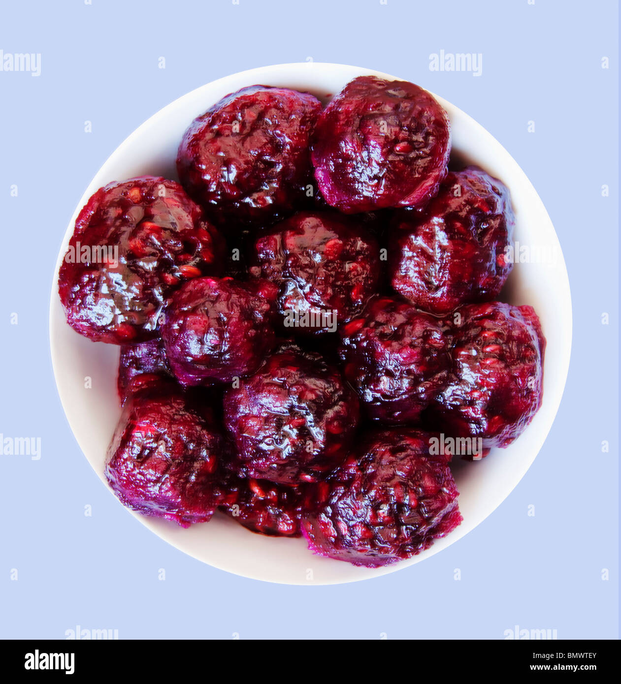 Peeled prickly pear cactus fruit  (Opuntia engelmannii) in white bowl on white background. Stock Photo