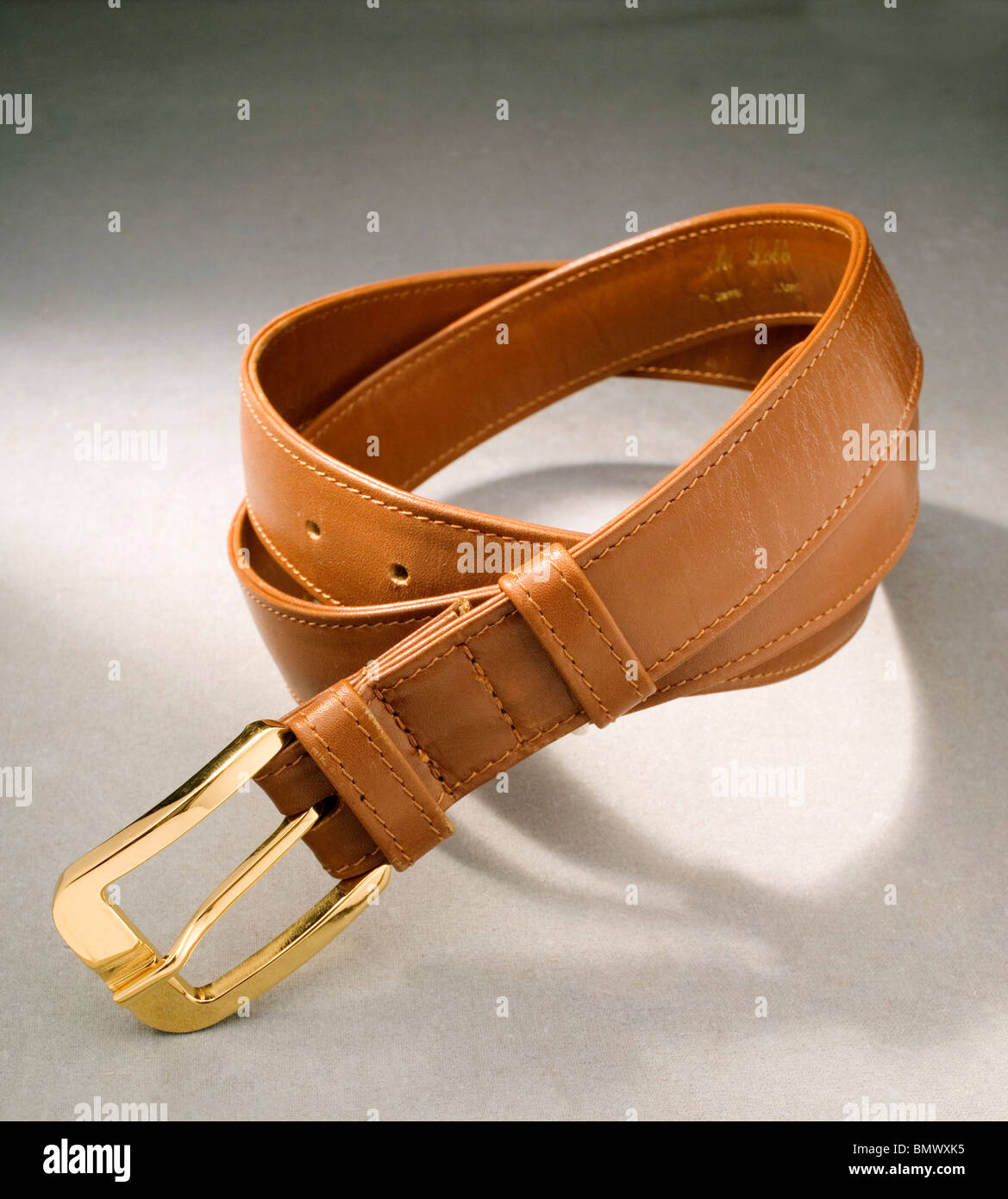 Gold Buckle light leather tan belt Stock Photo Alamy