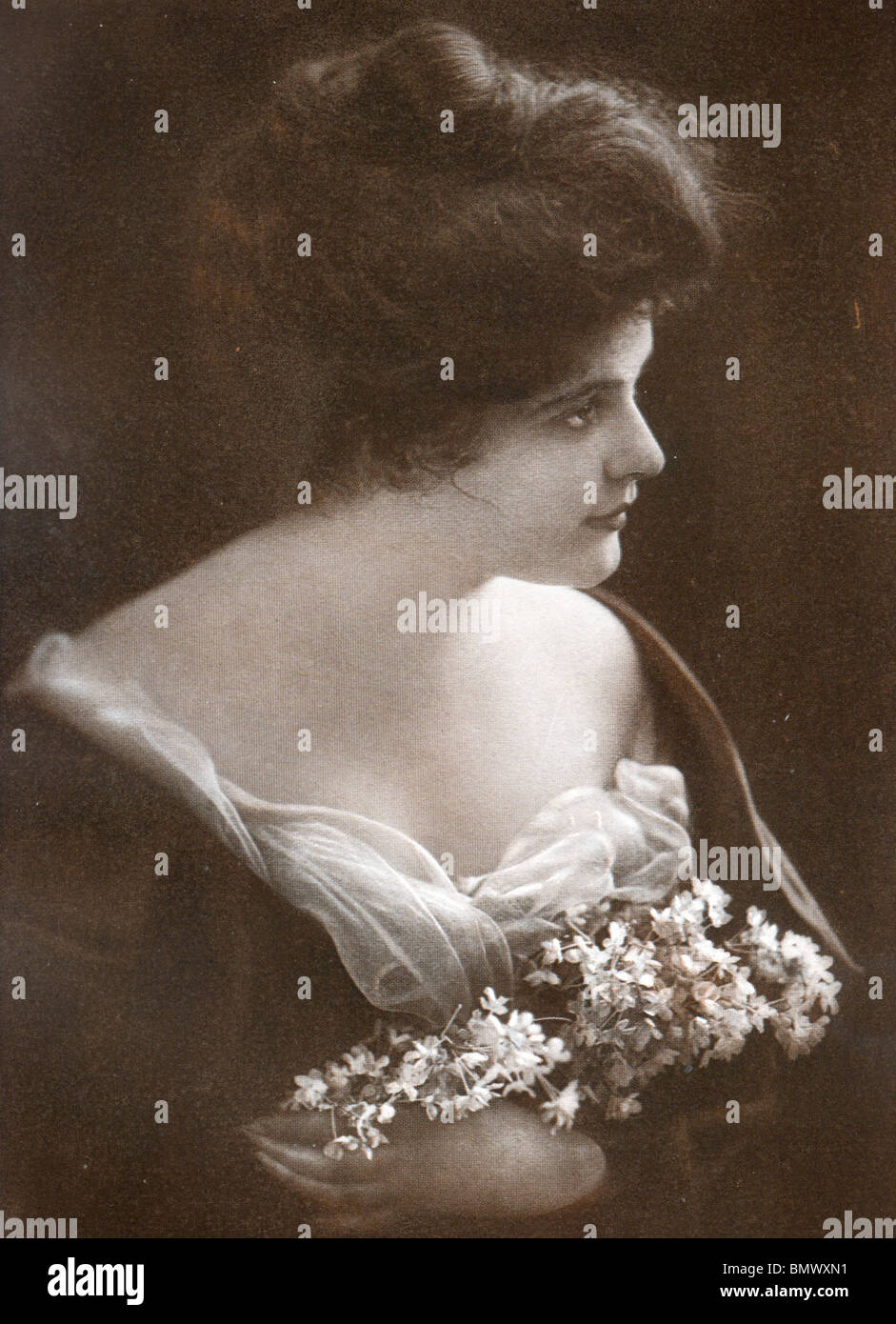 Portrait Study of a Woman Holding Flowers Stock Photo - Alamy