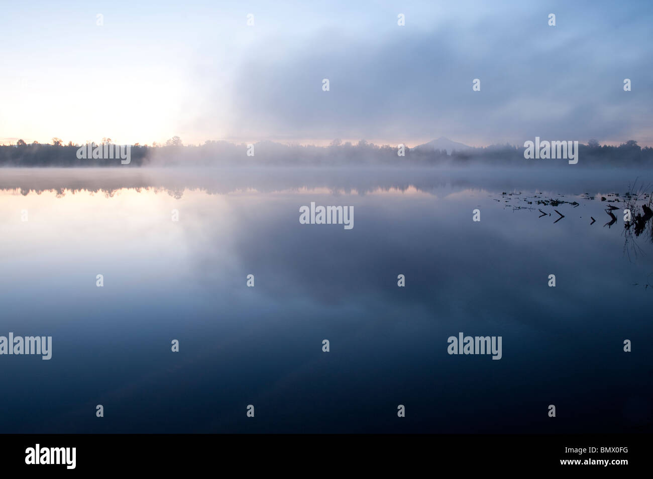 Sunrise Lake Cassidy with fog and Mount Pilchuck with reflections