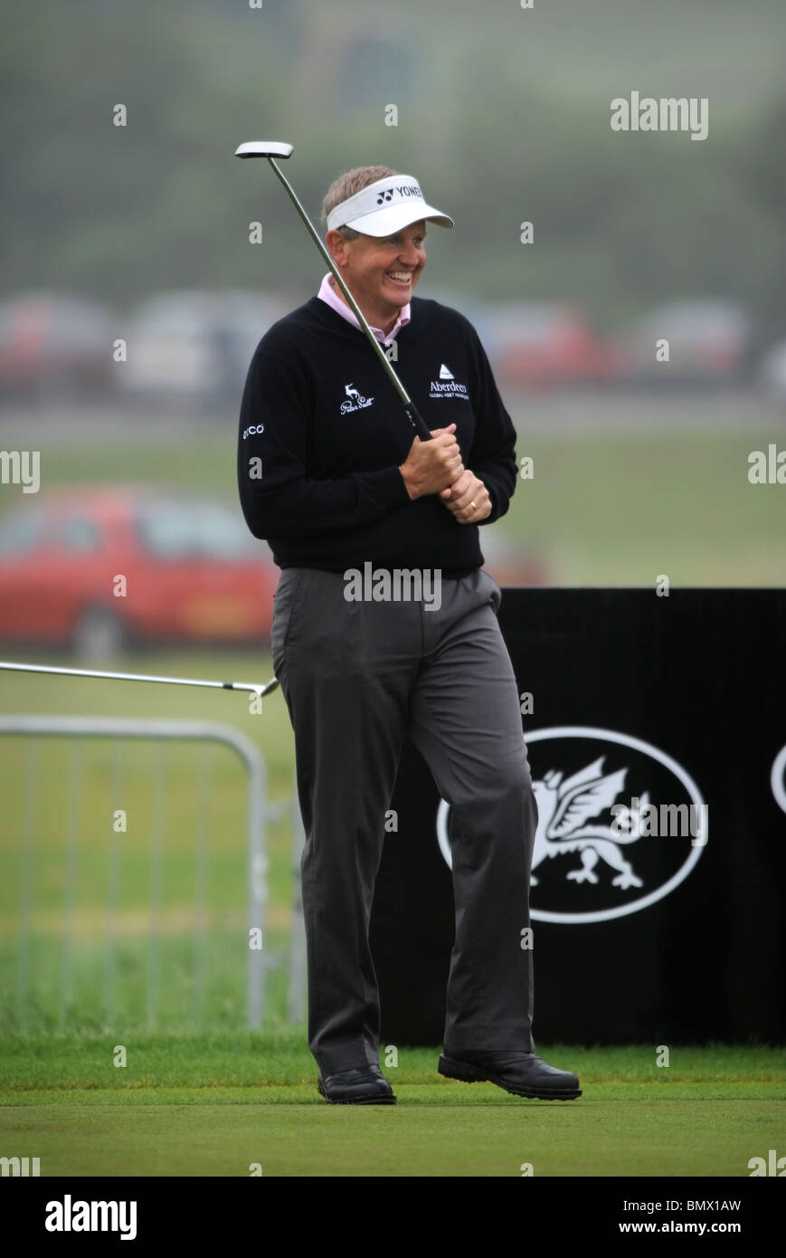 A fellow golfer appears to prod Colin Montgomerie with his putter on the practice green at The Celtic Manor Wales Open golf tour Stock Photo