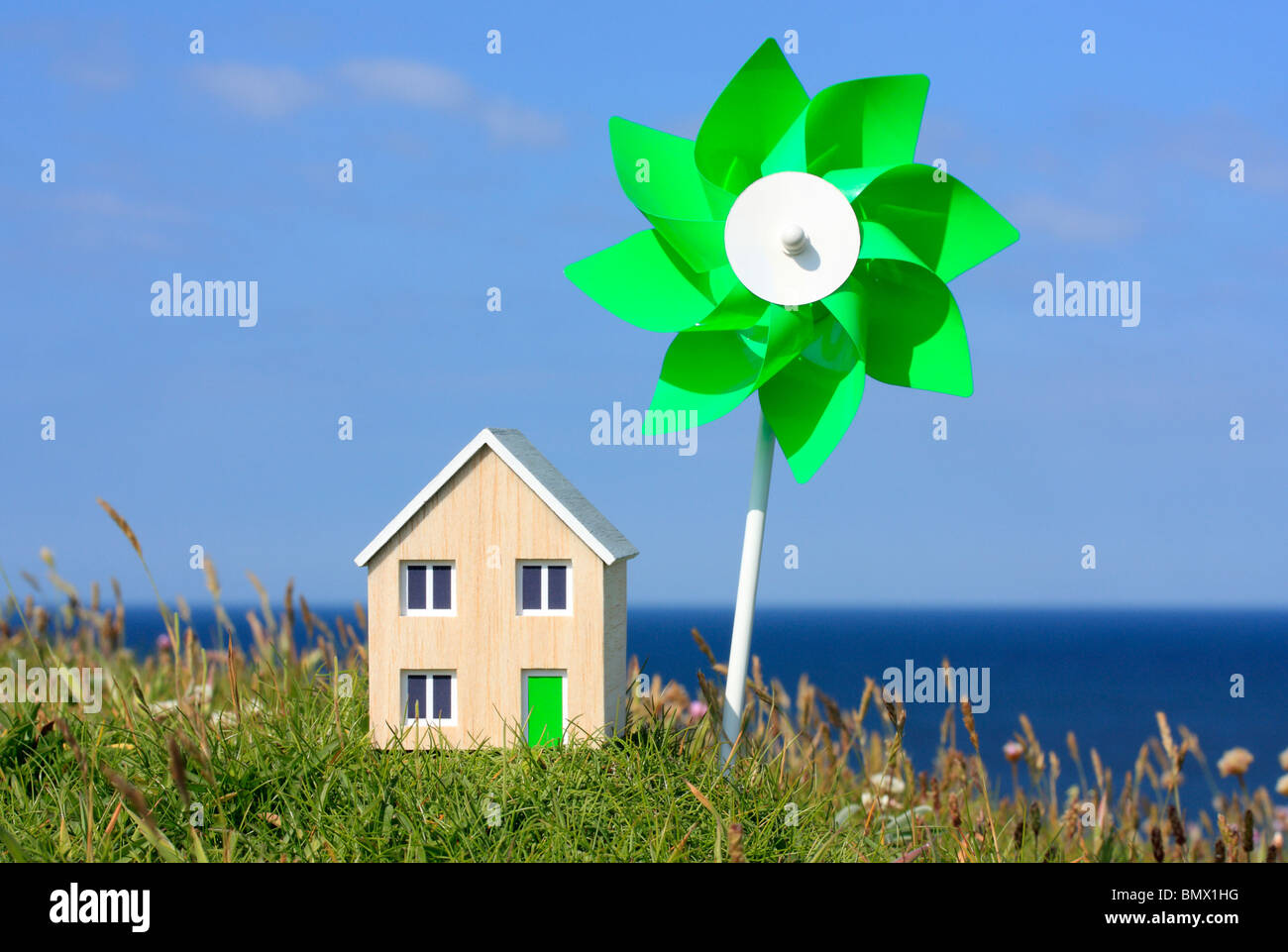 Model house and toy windmill. Stock Photo