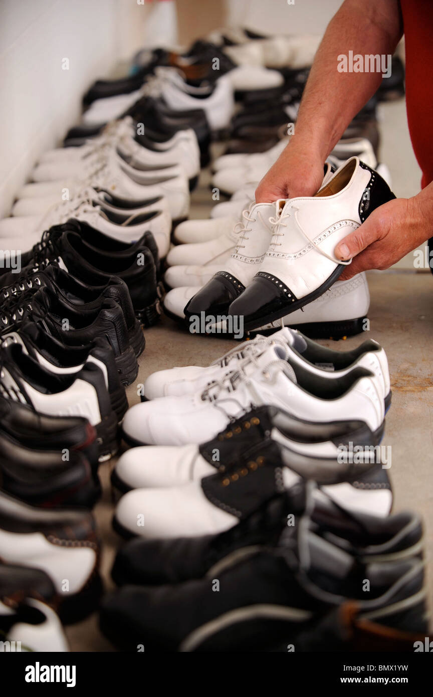 The competitors' golf shoes are cleaned in preperation for the opening