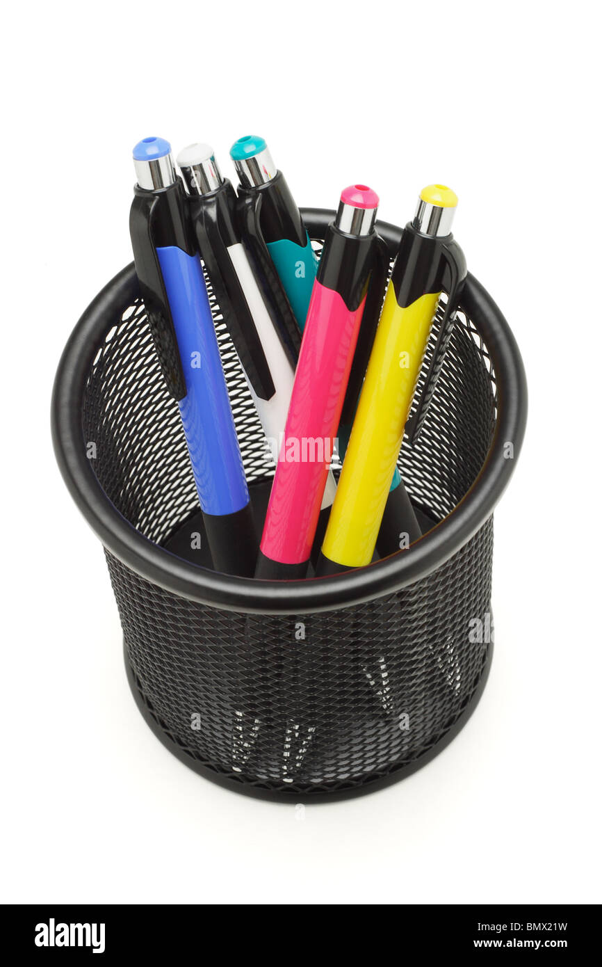 Multicolor ball point pens in black container on white Stock Photo