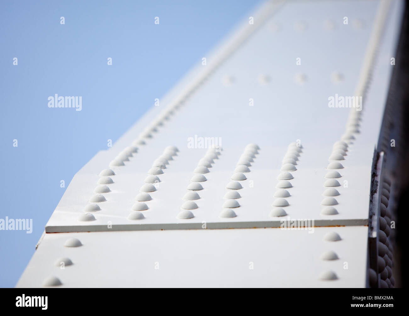 Closeup of a riveted joint in the iron bridge support structure Stock Photo