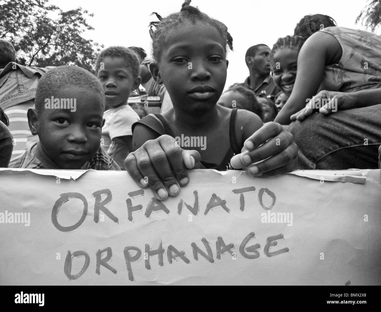 Orphans wait for aid in Port au Prince after the Haiti earthquake Stock Photo