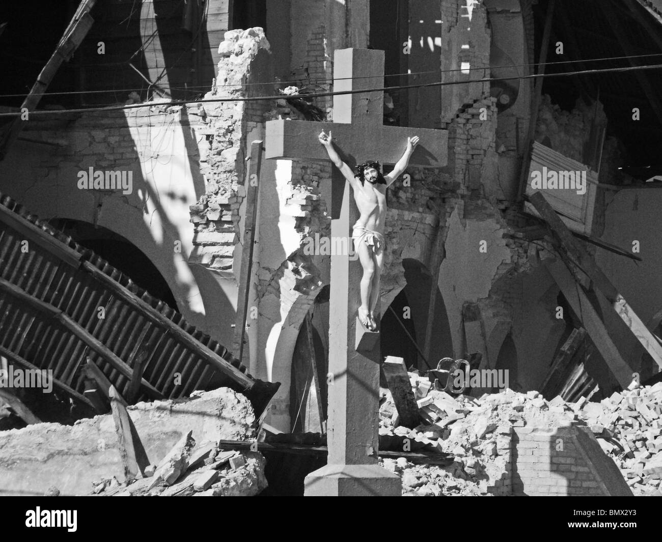 Jesus on the cross in front of a collapsed church in Port au Prince, after the Haiti earthquake Stock Photo