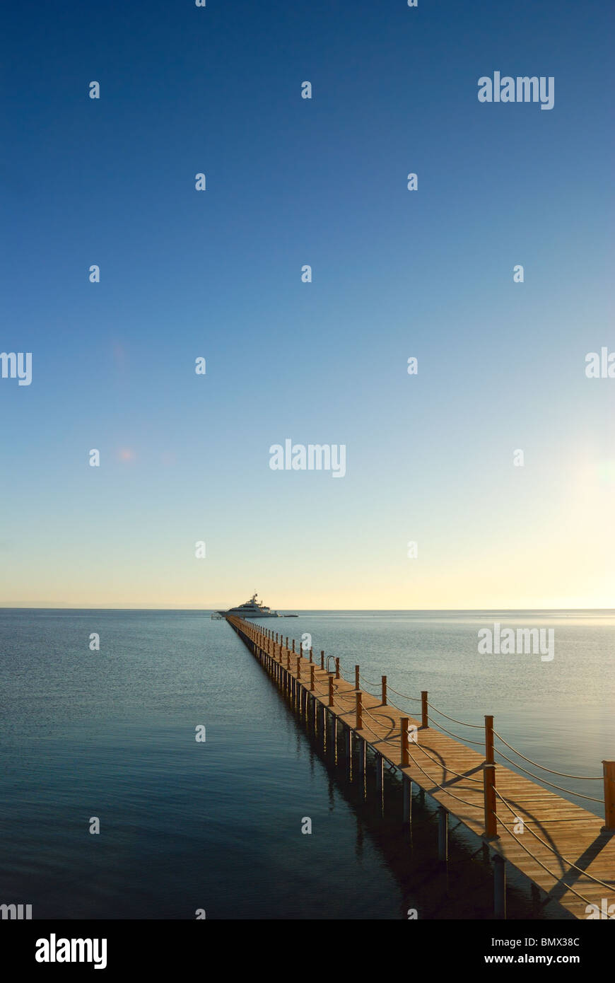 marine pier with yacht moored to Stock Photo - Alamy