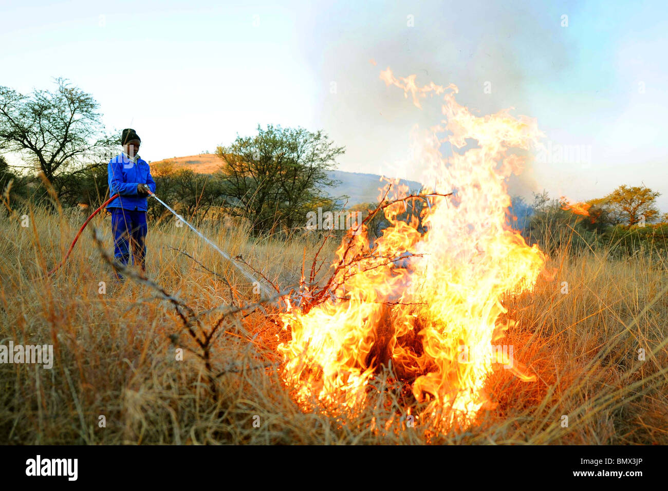 RANCH WORKERS CREAT FIREBREAKS 2010 FIFA WORLD CUP SOUTH AFRI KARMA RANCH  SOUTH AFRICA 21 June 2010 Stock Photo