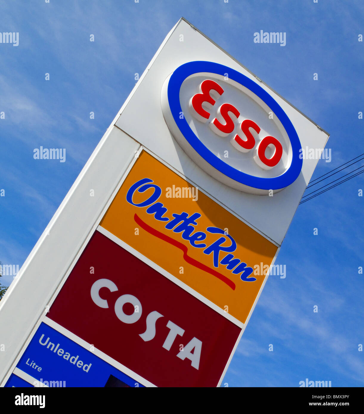 Esso logo outside petrol forecourt and Costa Coffee logo below Stock Photo