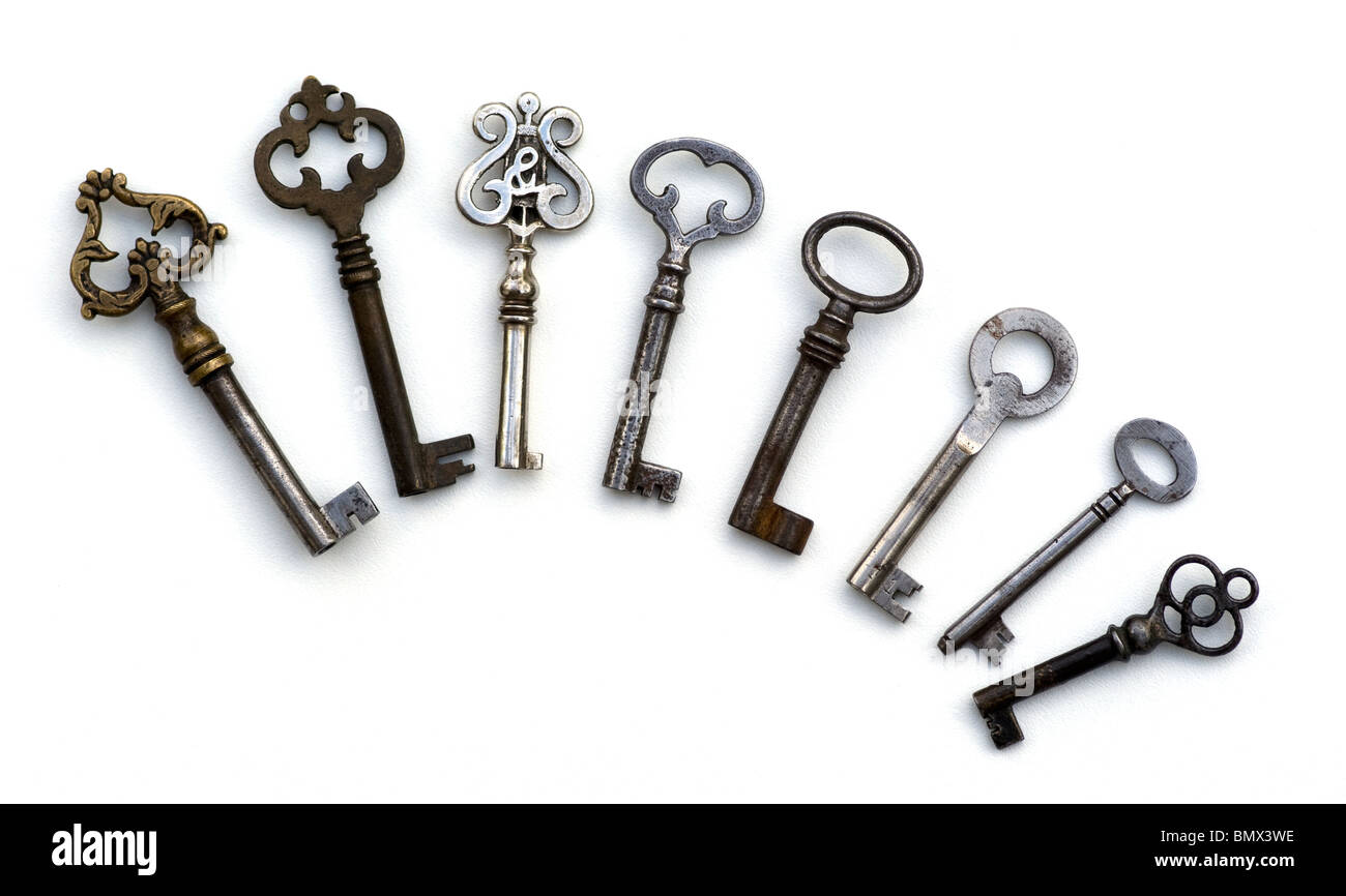 8 antique skeleton keys isolated with ornate workmanship on the handles