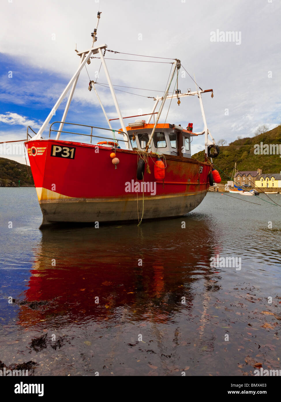 Fishing boat moored in the harbour at Lower Fishguard in Pembrokeshire South Wales Stock Photo