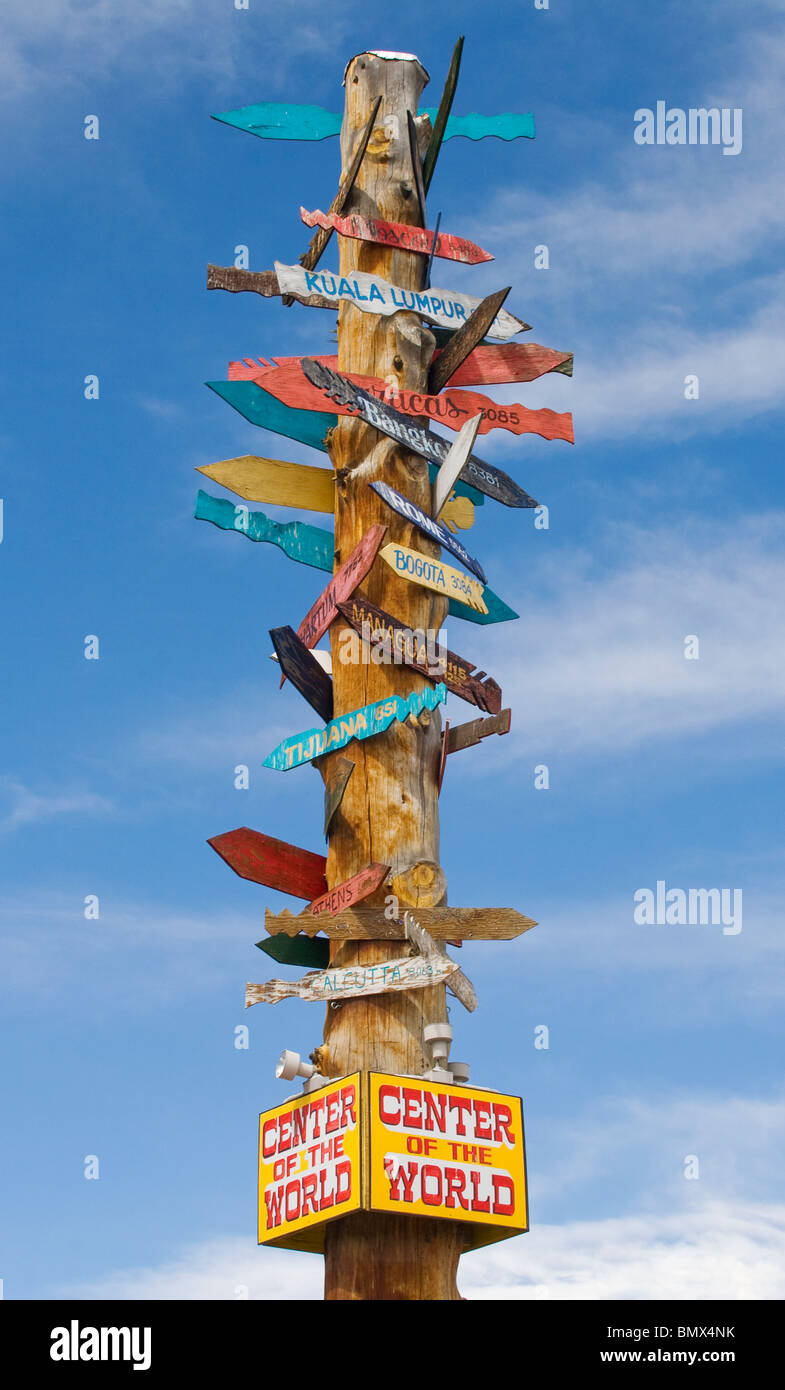 Direction arrows to various cities at the Center of the World in Golden