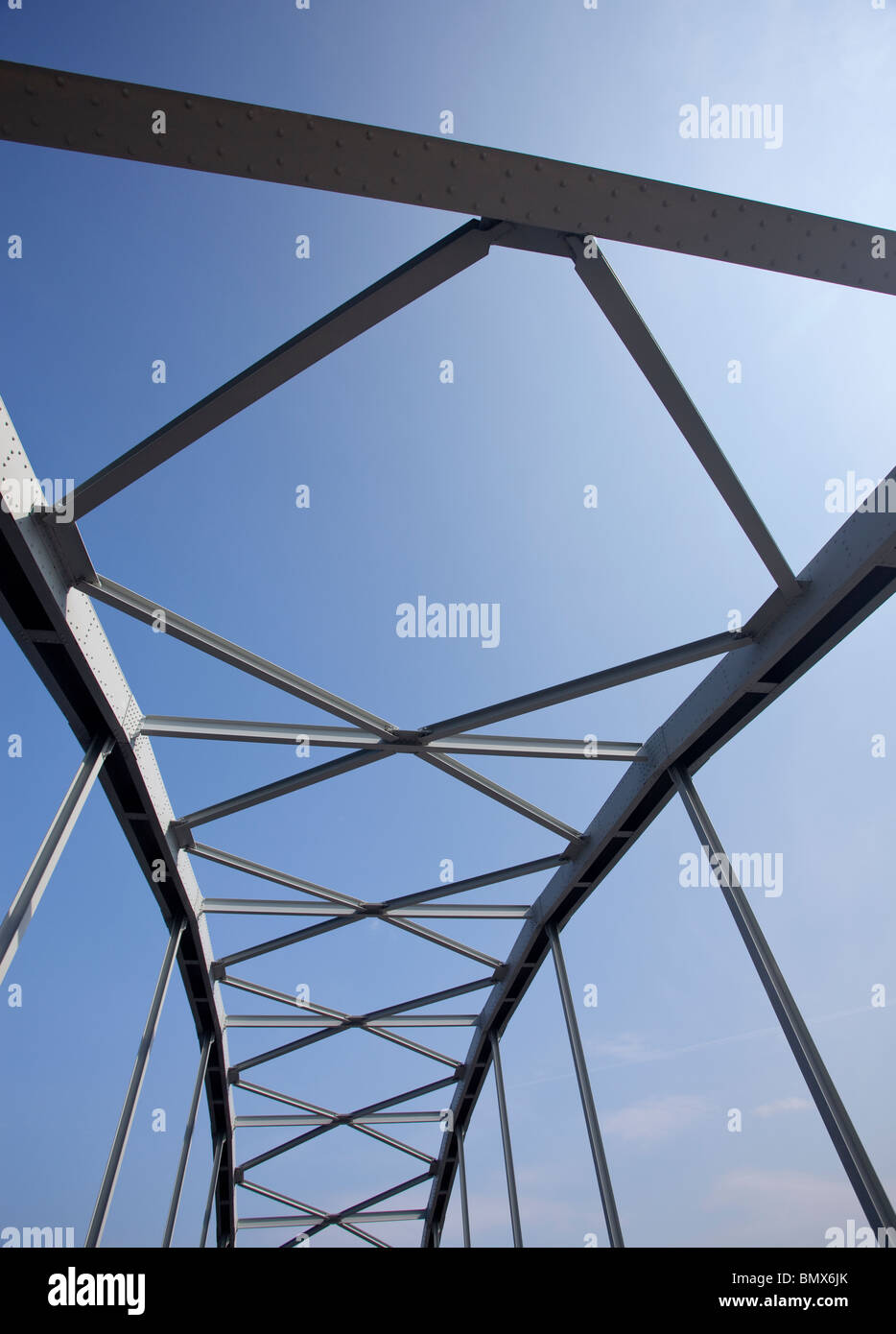 Iron bridge support structure, using riveted steel girders. Stock Photo
