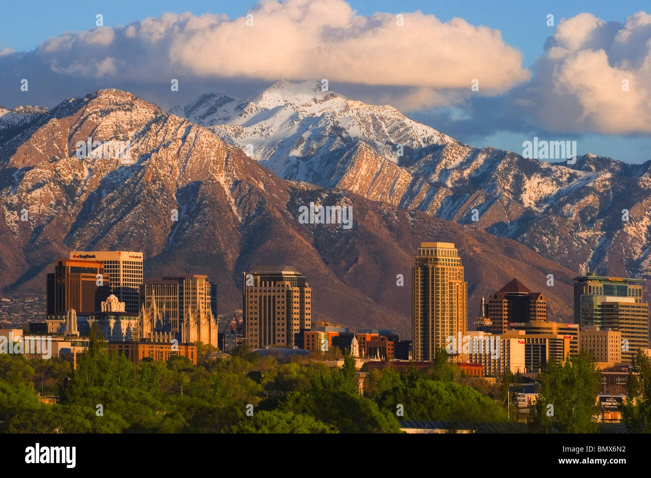Salt Lake City Utah skyline showing downtown buildings and the snow-covered Wasatch Mountains in the background. Stock Photo