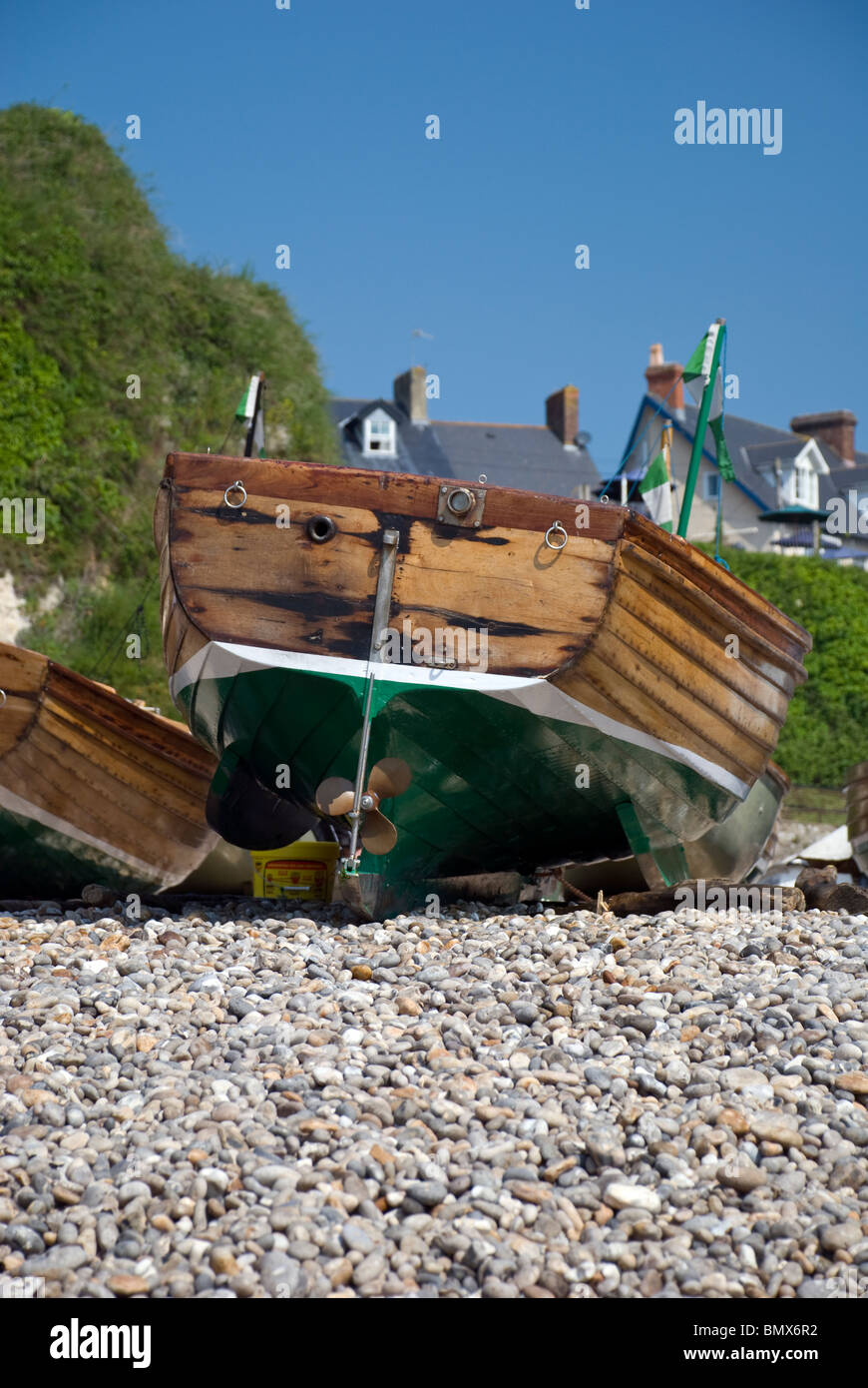 fishing boats for hire beer beach devon Stock Photo Alamy