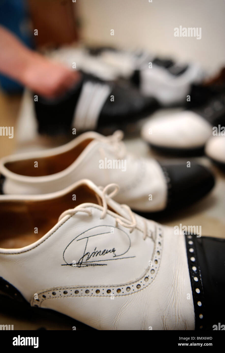 The competitors' golf shoes are cleaned in preperation for the opening