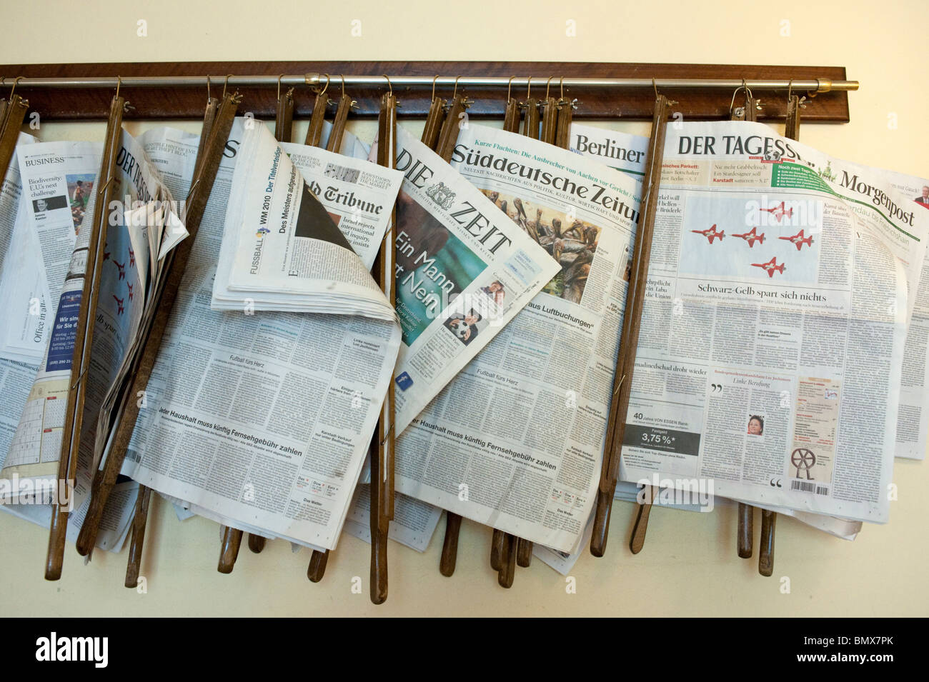 Newspapers hanging on rack at famous Cafe Einstein in Charlottenburg in