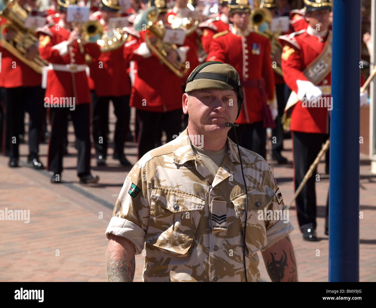 A soldier of the Yorkshire Regiment leads the Band of the Kings