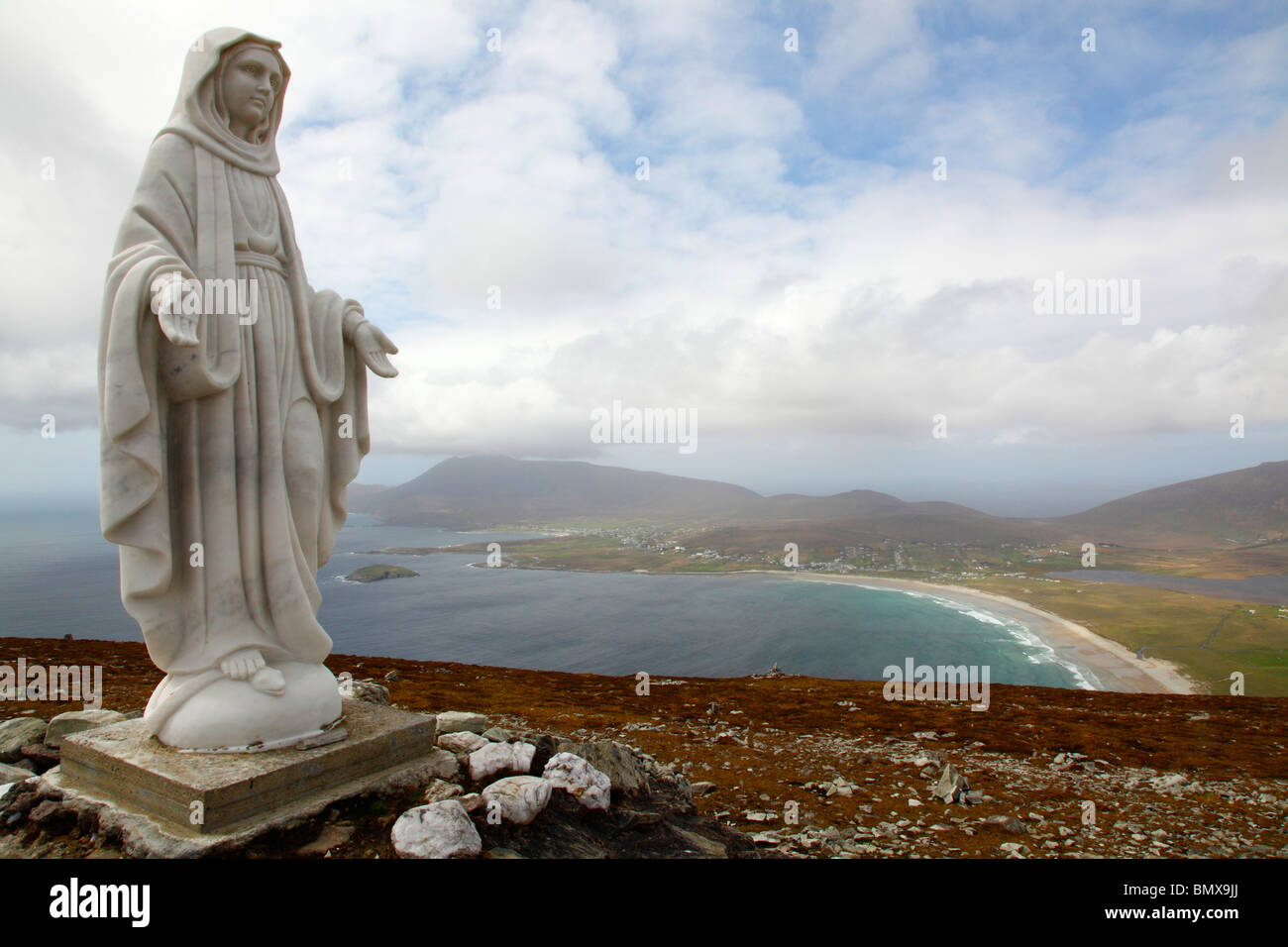 The statue of Mary, backdrop of Trawmore strand, Summit of Minuaun, Achill Island,Co Mayo,Western Ireland,Eire. Stock Photo
