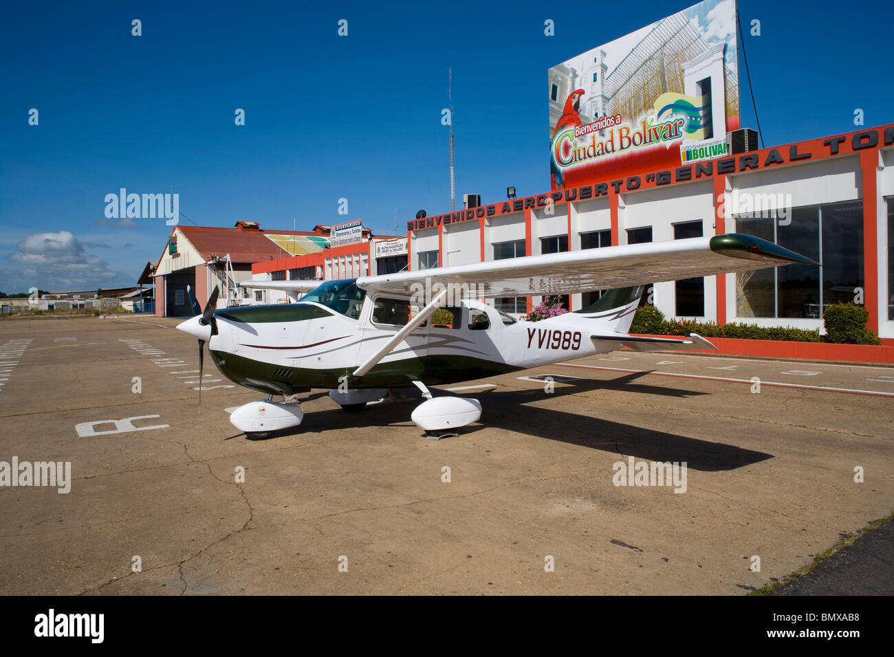 VENEZUELA / BOLIVAR - GUAYANA /CIUDAD BOLIVAR / AIRPORT Cessna airplane parked outside the main terminal at ciudad Bolivar city Stock Photo