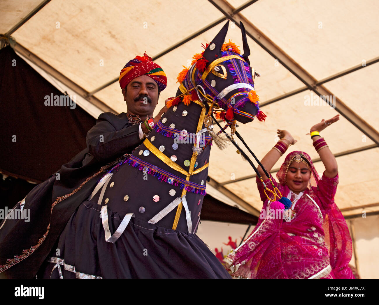 Two Rajasthani dancers performing a traditional Kachhi Ghodi wedding dance as part of the Glasgow Mela 2010 in Kevingrove Park. Stock Photo