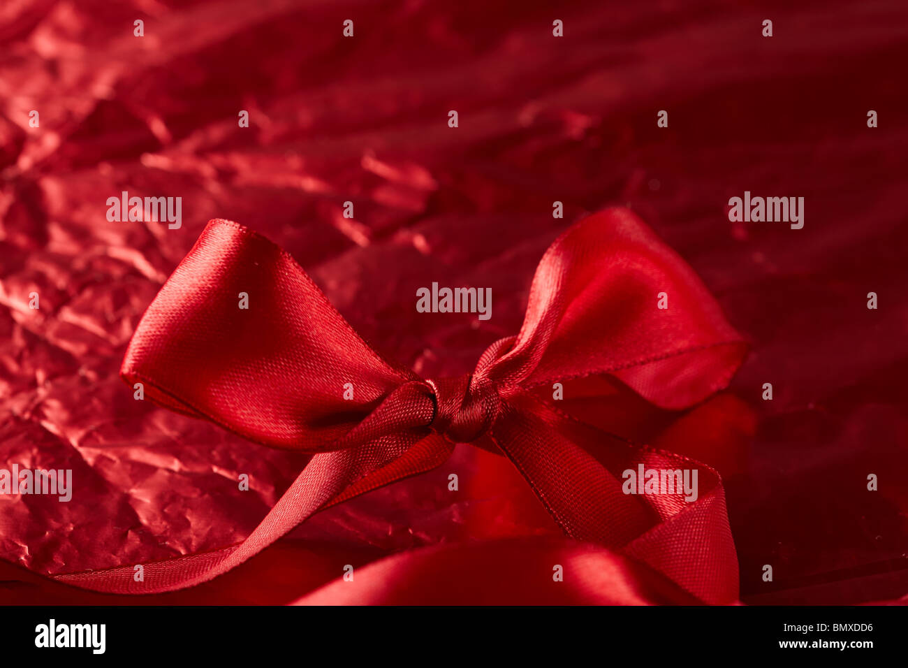 satin ribbons on the red background Stock Photo - Alamy