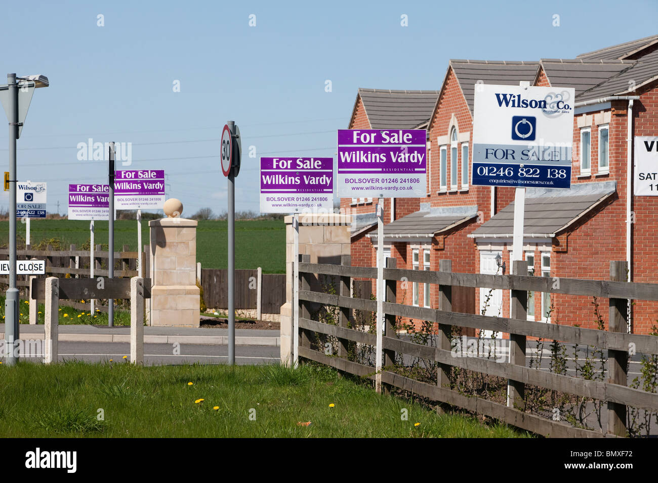 Property For Sale boards outside new houses in Nottinghamshire Stock