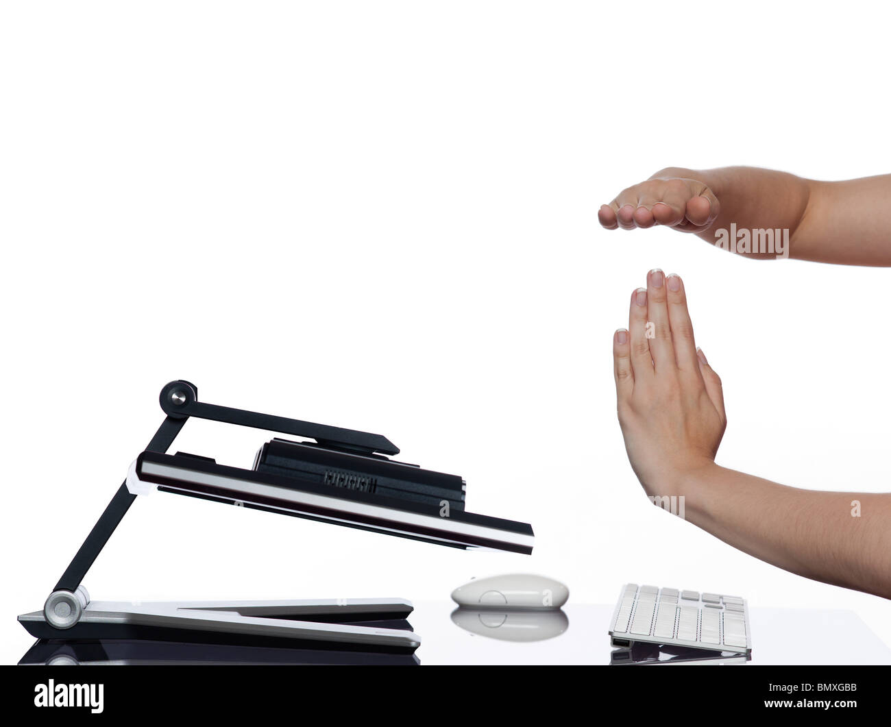 communication between human hand and a computer display monitor on isolated white background expressing breakdown capitulation concept Stock Photo