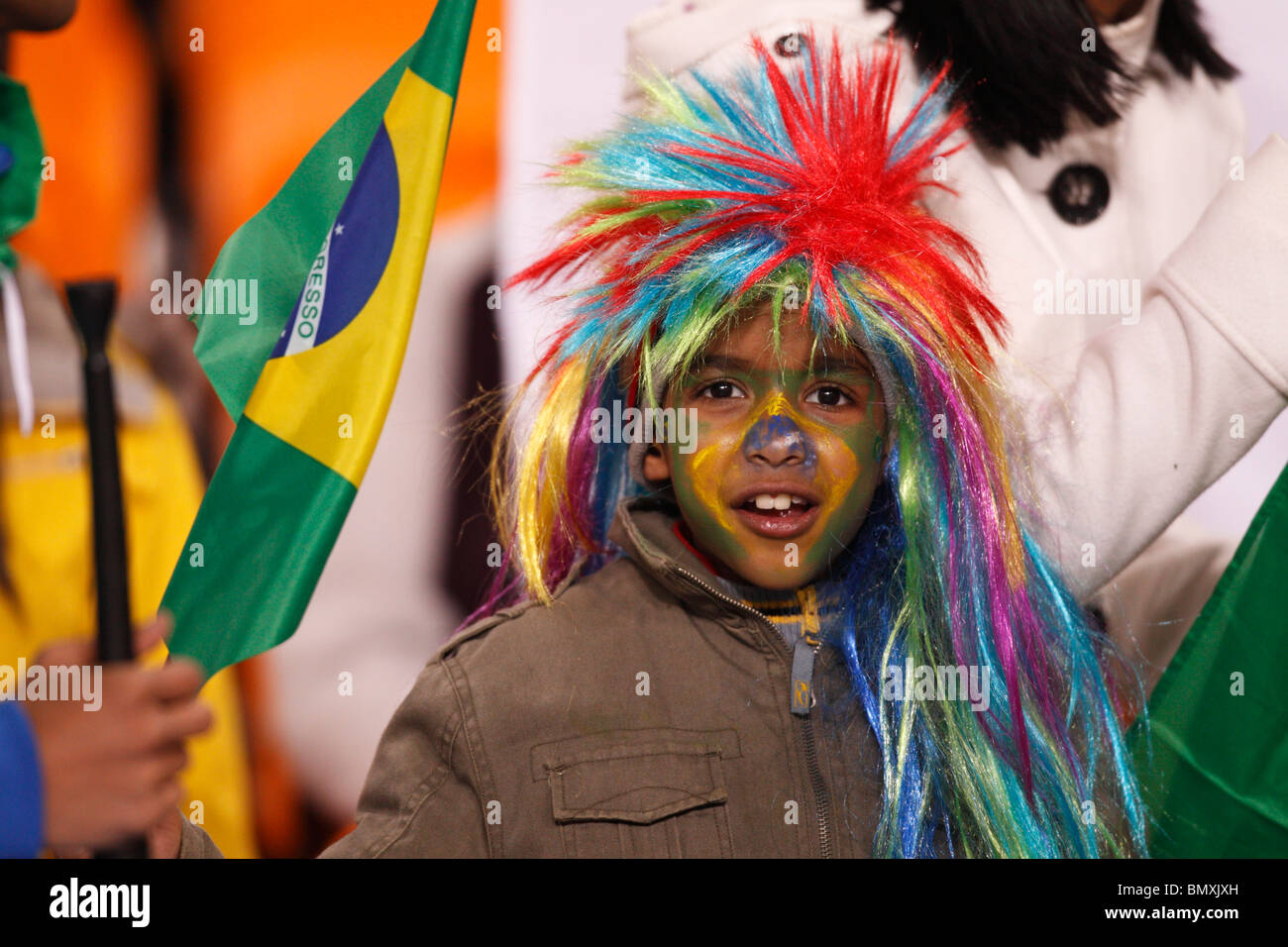 Young spectator at a 2010 FIFA World Cup football match between Brazil and Côte d'Ivoire June 20, 2010. Stock Photo