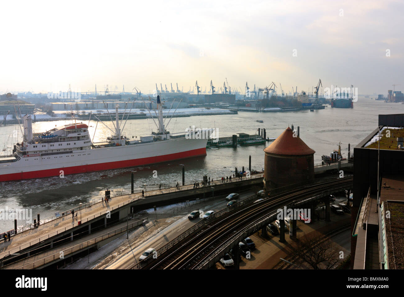 Museum Ship 'Cap San Diego' at Hamburg Landungsbruecken with Blohm & Voss Shipyard in the background Stock Photo