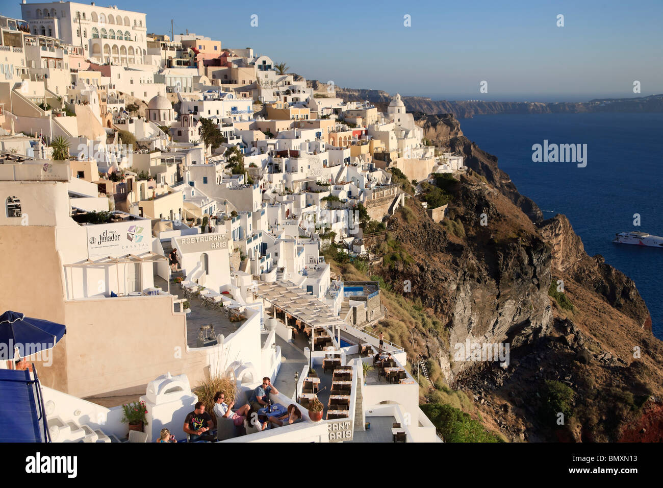 Greece, Cyclades, Santorini, Fira (Thira), Outdoor Cafe and Caldera View Stock Photo