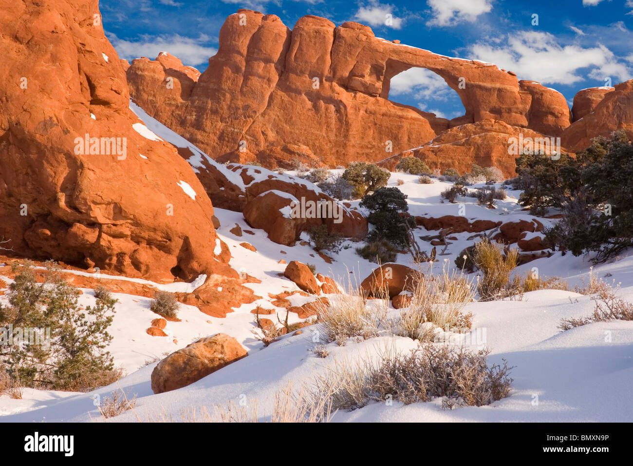 Winter snow on Skyline Arch in Arches National Park southeastern Utah USA Stock Photo