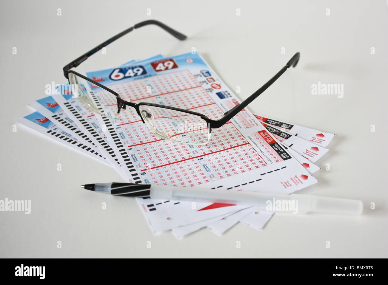 stack blank lottery game ticket glasses pen 649 Stock Photo Alamy