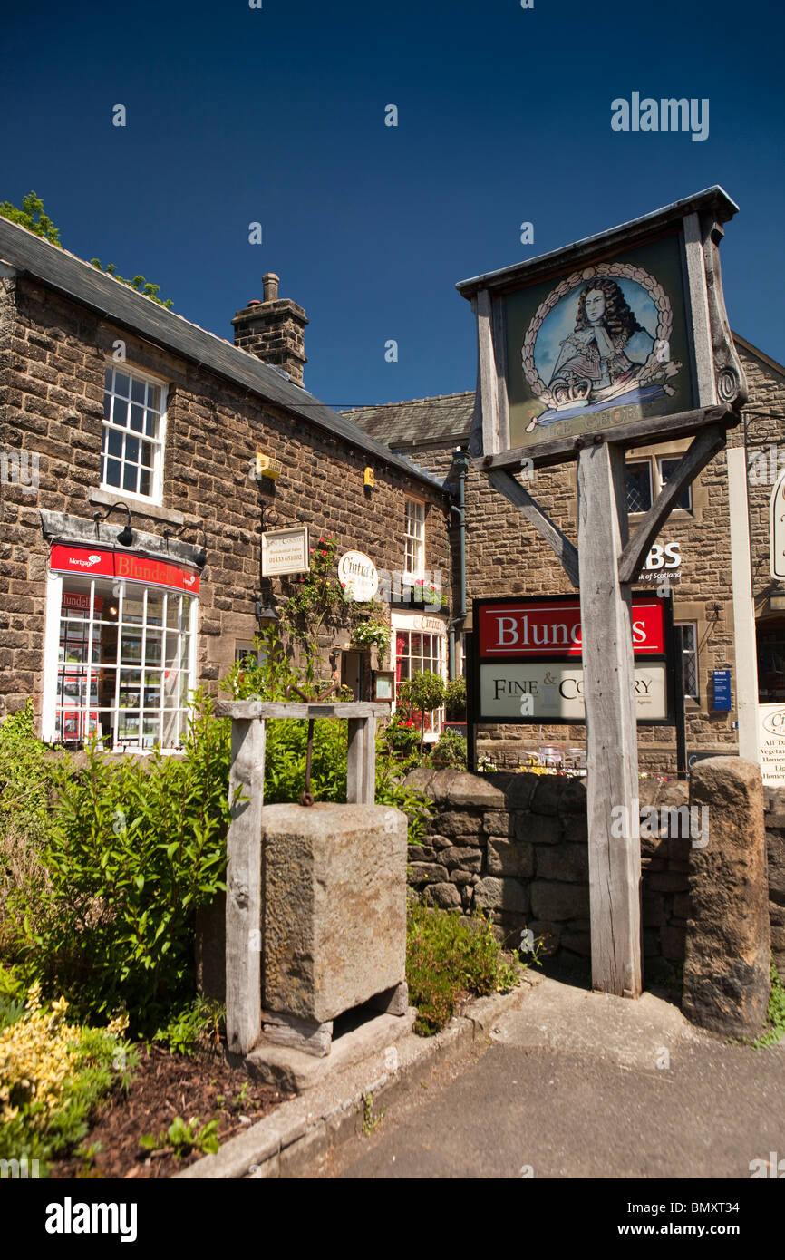 UK, England, Derbyshire, Peak District, Hathersage, Main Street, old stone Cheese press at George Hotel sign Stock Photo