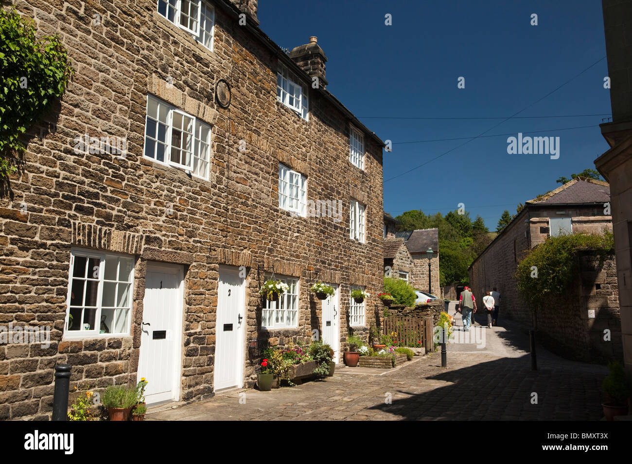 UK, England, Derbyshire, Peak District, Hathersage, Main Street, three storey weaver’s cottages Stock Photo