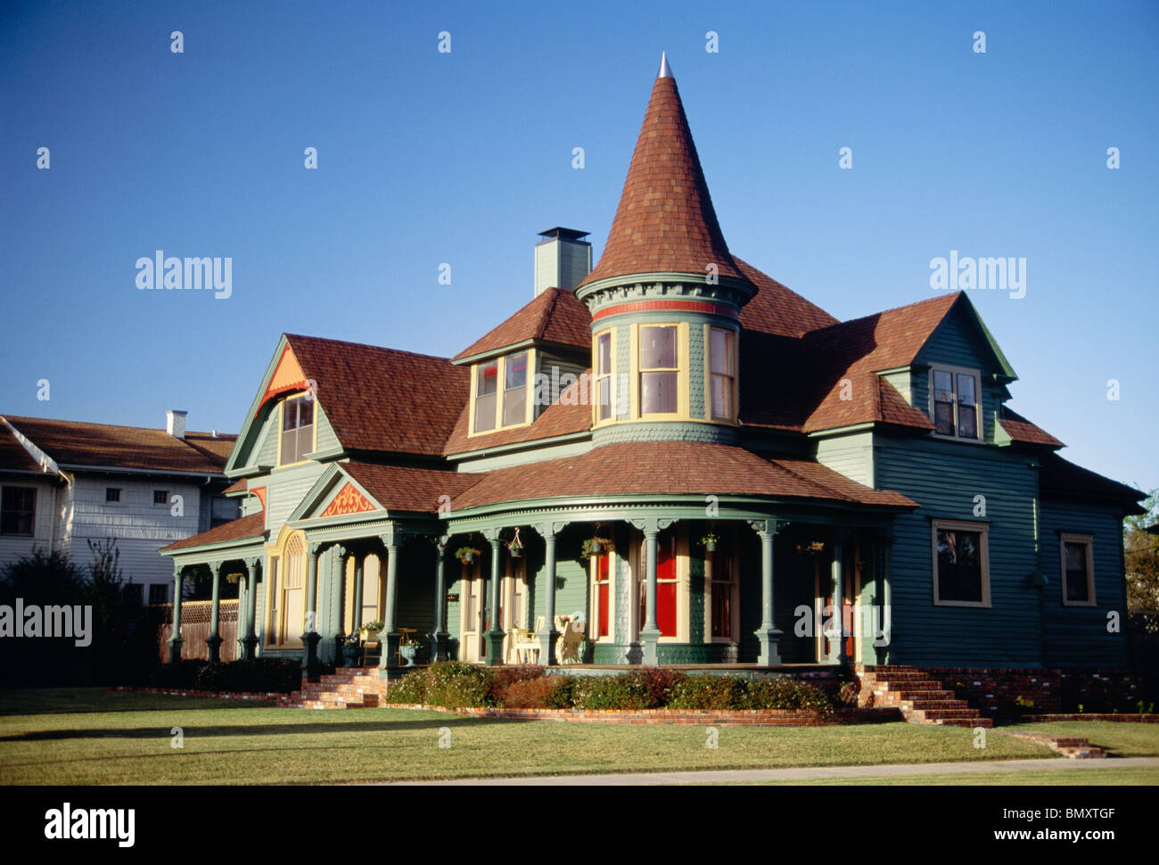 This stately restored Victorian style home features a turret and wrap