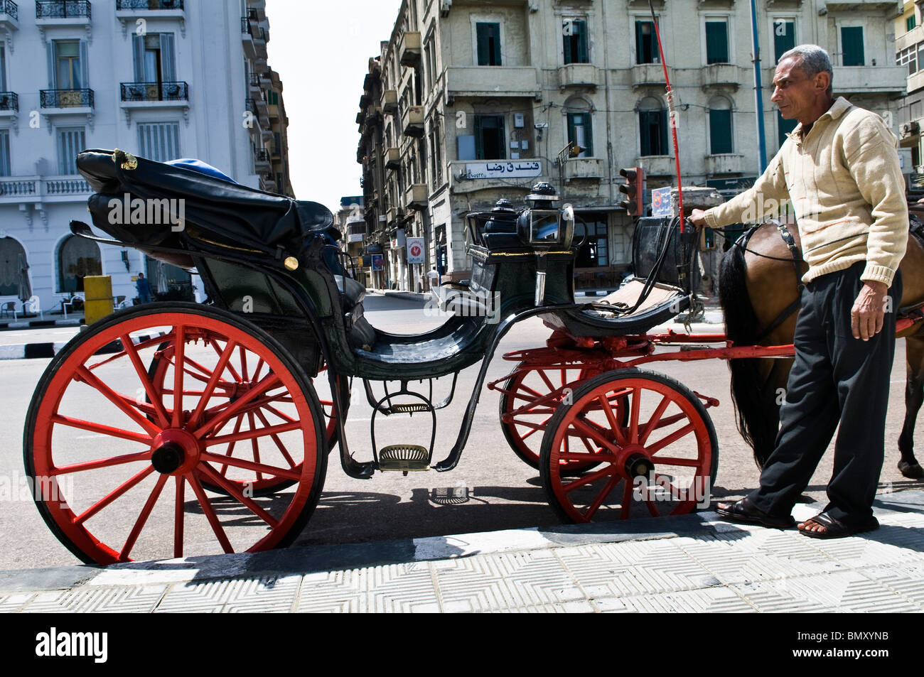 Old horse carts roam the streets of Alexandria, mostly along the Mediterranean sea promenade. Stock Photo